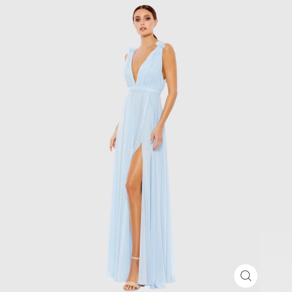 Powder blue chiffon maxi dress with a plunging v-neckline and thigh high slit.